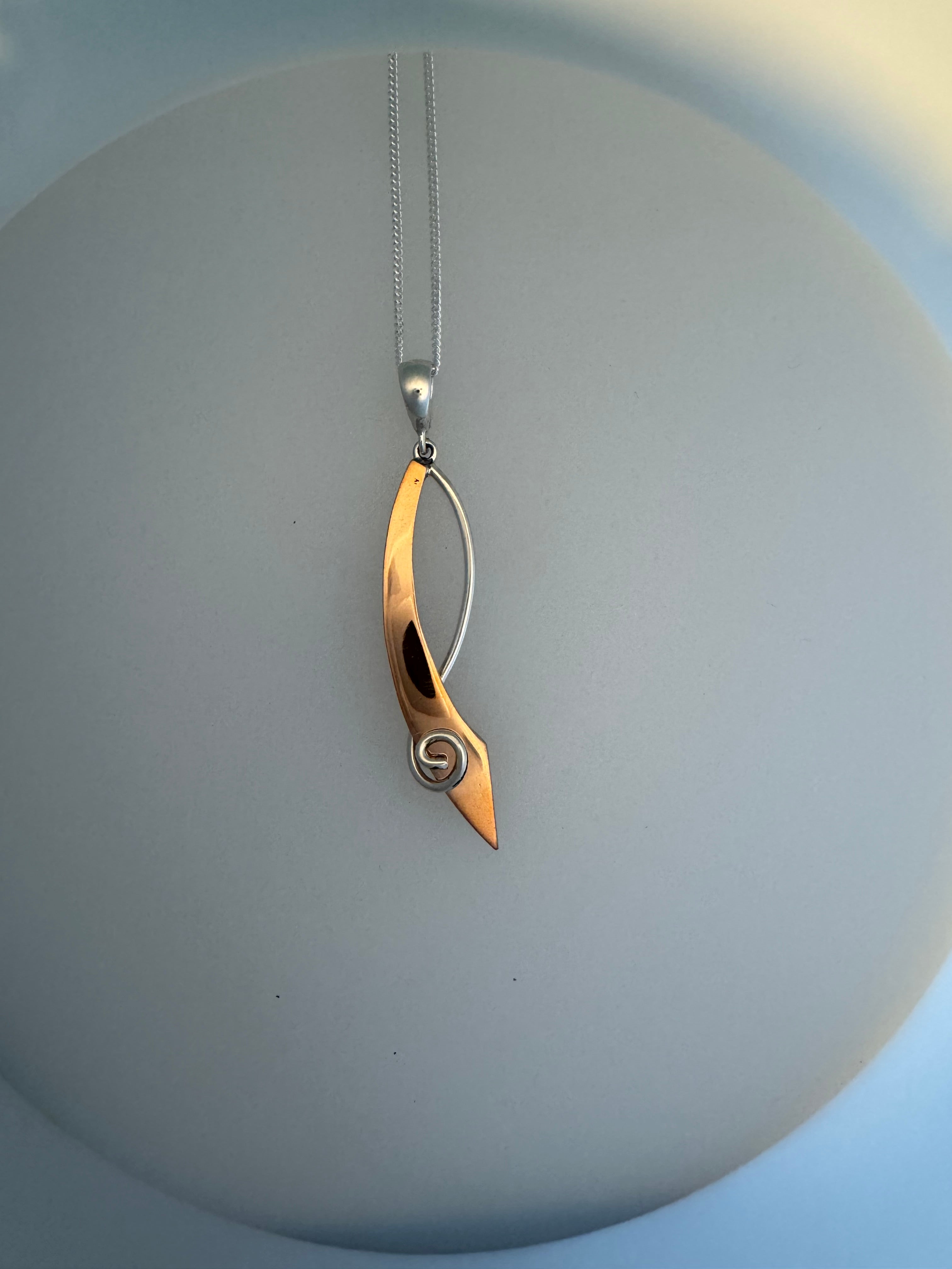 Pendant with copper and silver
